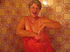 Oh Im so HOT i need a nice cool shower Jumping into the tub with my sexy gown on watch as it clings to me my hard nipples showing through maybe some b